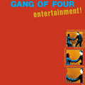 Cease & Desist Records vinyl LP of Gang of Four's "Entertainment" 12-inch album with colorful cover art.