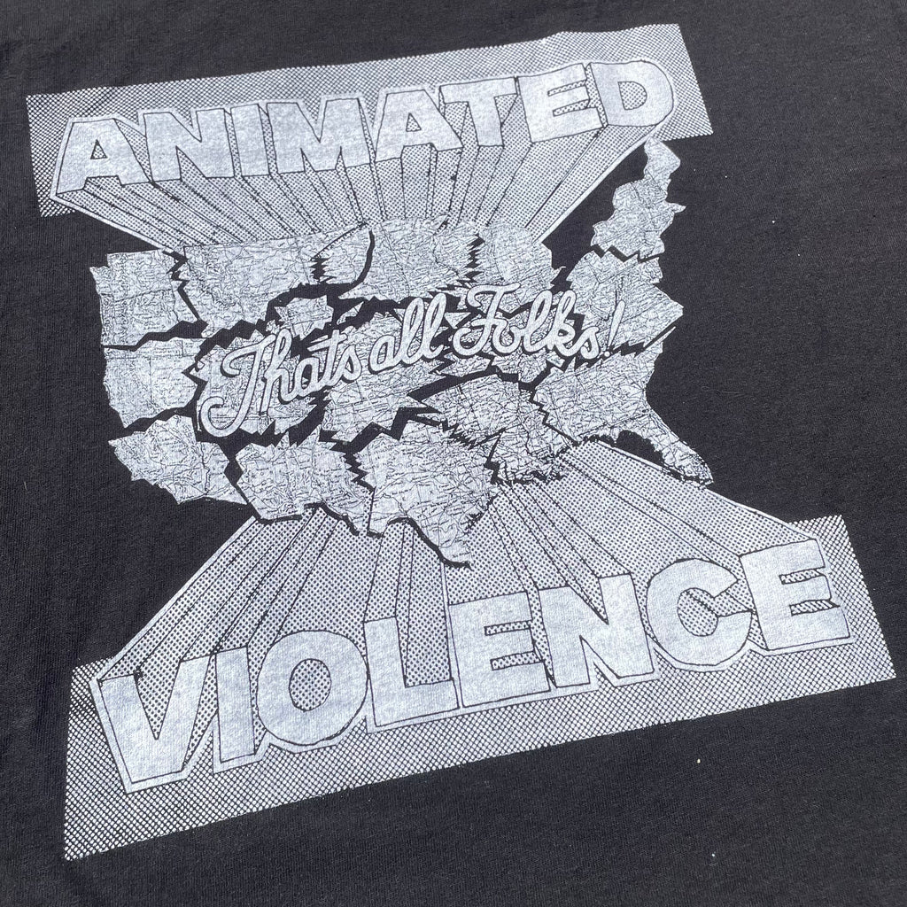 Animated Violence T-Shirt from Cease & Desist Records showing a graphic design on black cotton fabric.