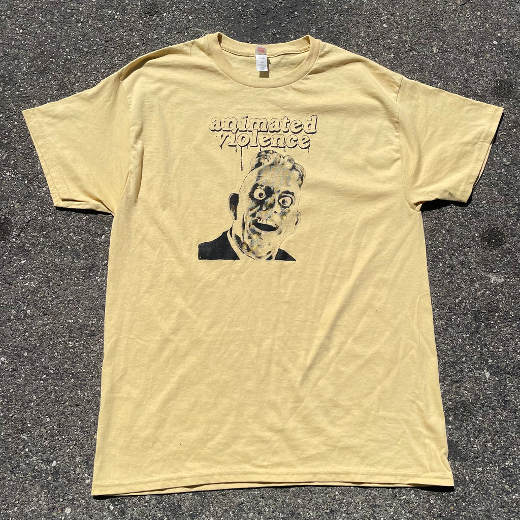 Animated Violence T-shirt from Cease & Desist Records featuring vibrant graphic artwork on a casual clothing top.
