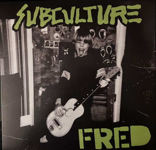 Close-up of the vinyl record "Subculture: Fred" 12-inch LP by Cease & Desist Records featuring the album cover and record label.