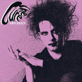Close-up of The Cure Unplugged 12-inch vinyl record by Cease & Desist Records, showing the album cover and textured surface.